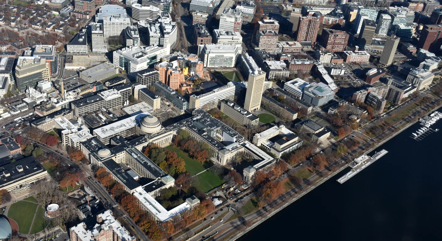 Aerial photograph of MIT’s main campus beside the Charles River in Cambridge, Massachusetts