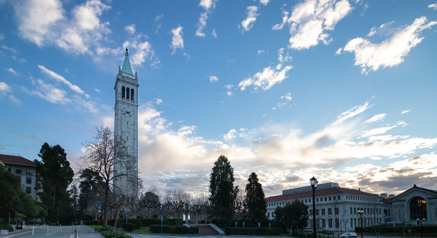 Sather Tower and the UC Berkeley campus under a blue sky