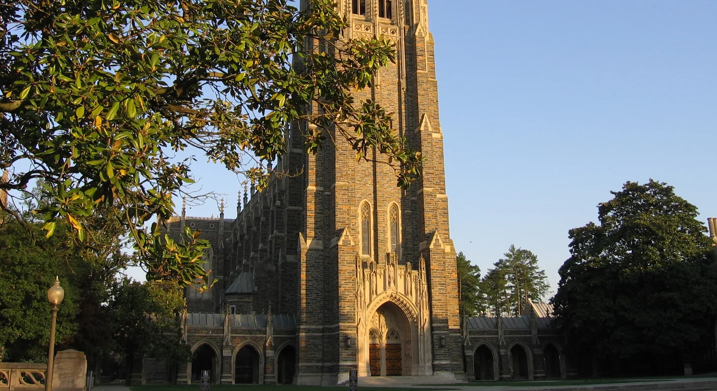 Duke Chapel framed by trees in morning light