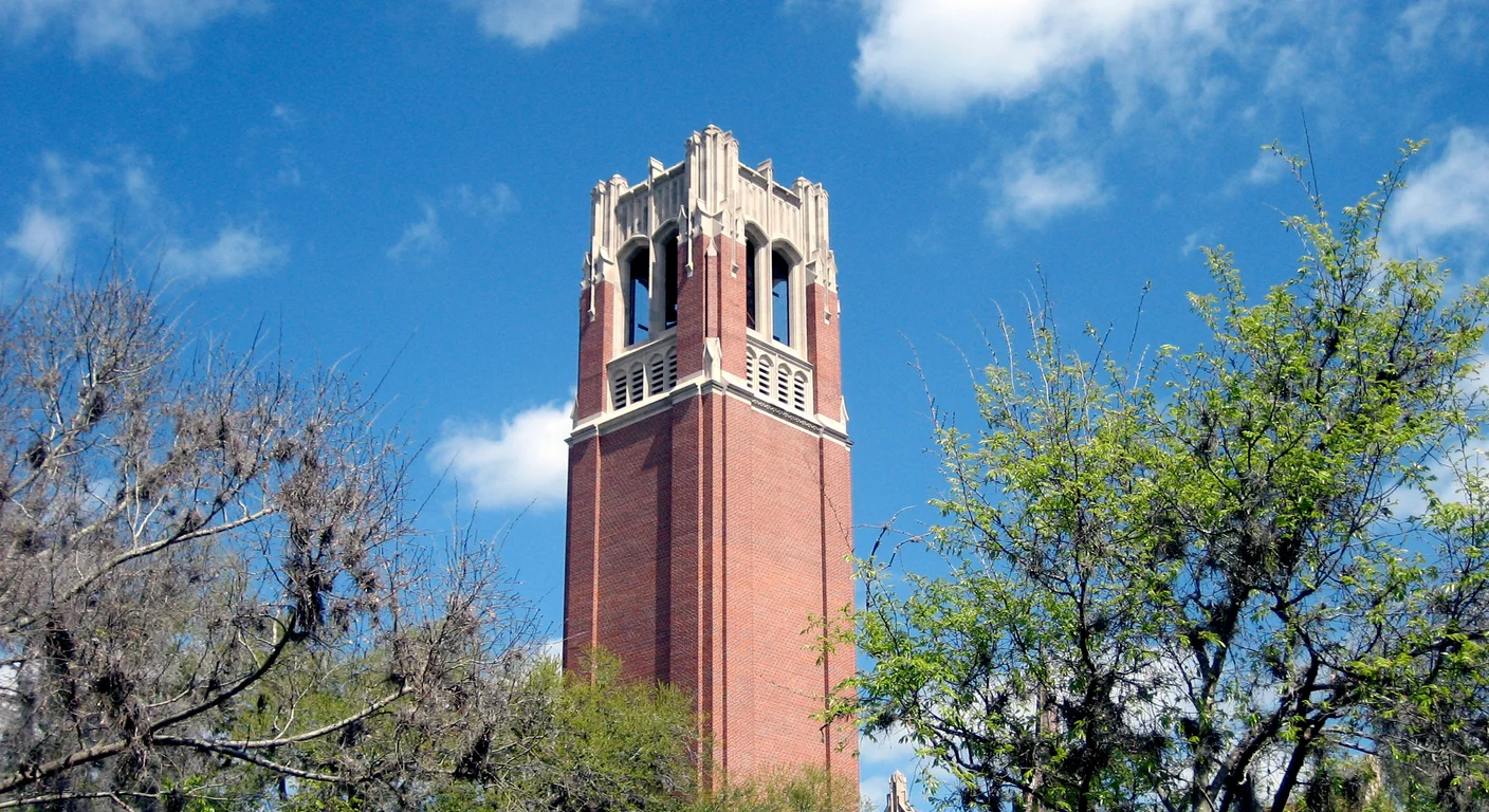 Century Tower rising above trees on the University of Florida campus